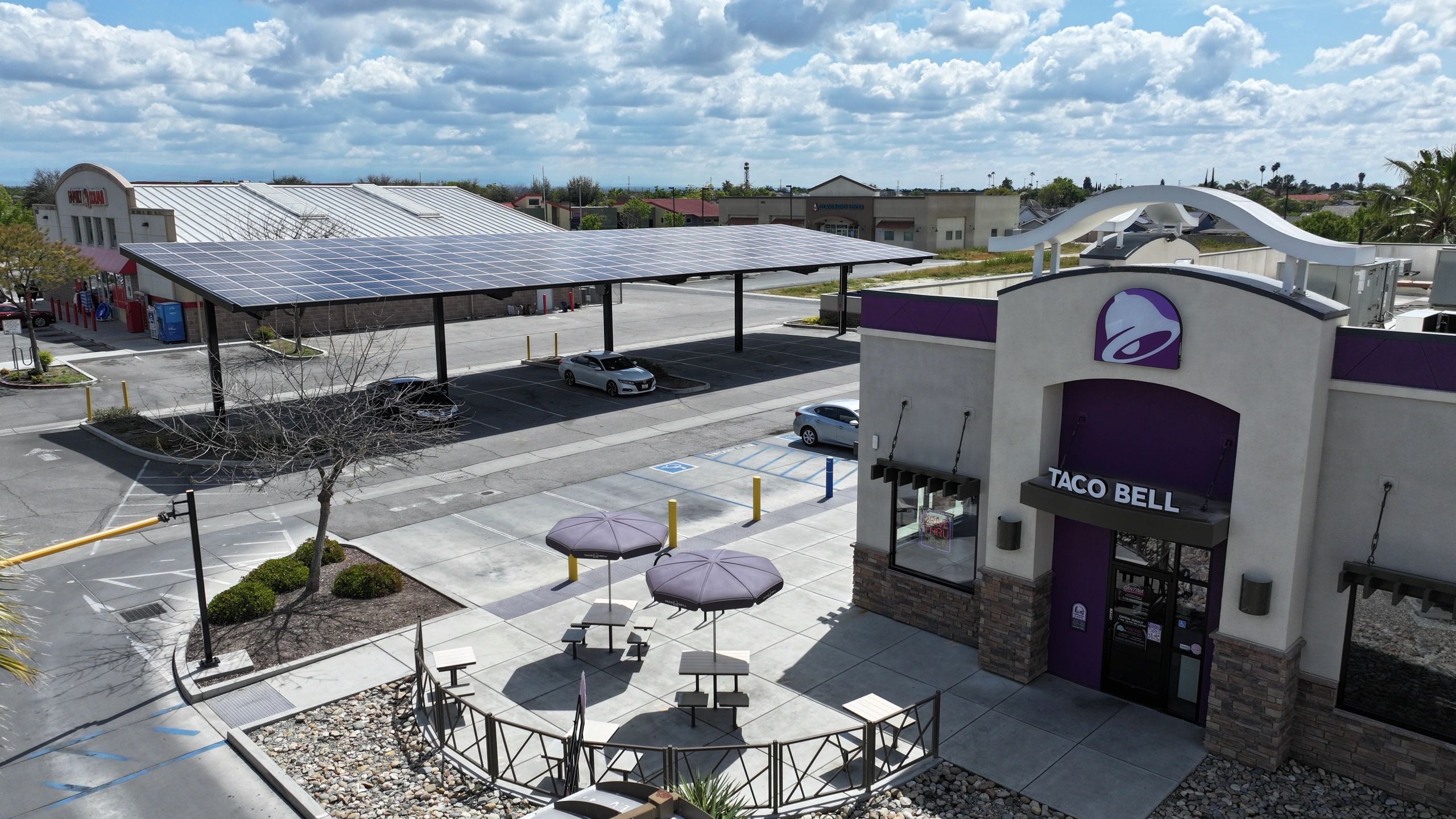 Aerial view of Taco Bell with solar canopy and outdoor patio